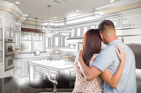 Young-couple-superimposed-on-plans-for-remodeled-kitchen