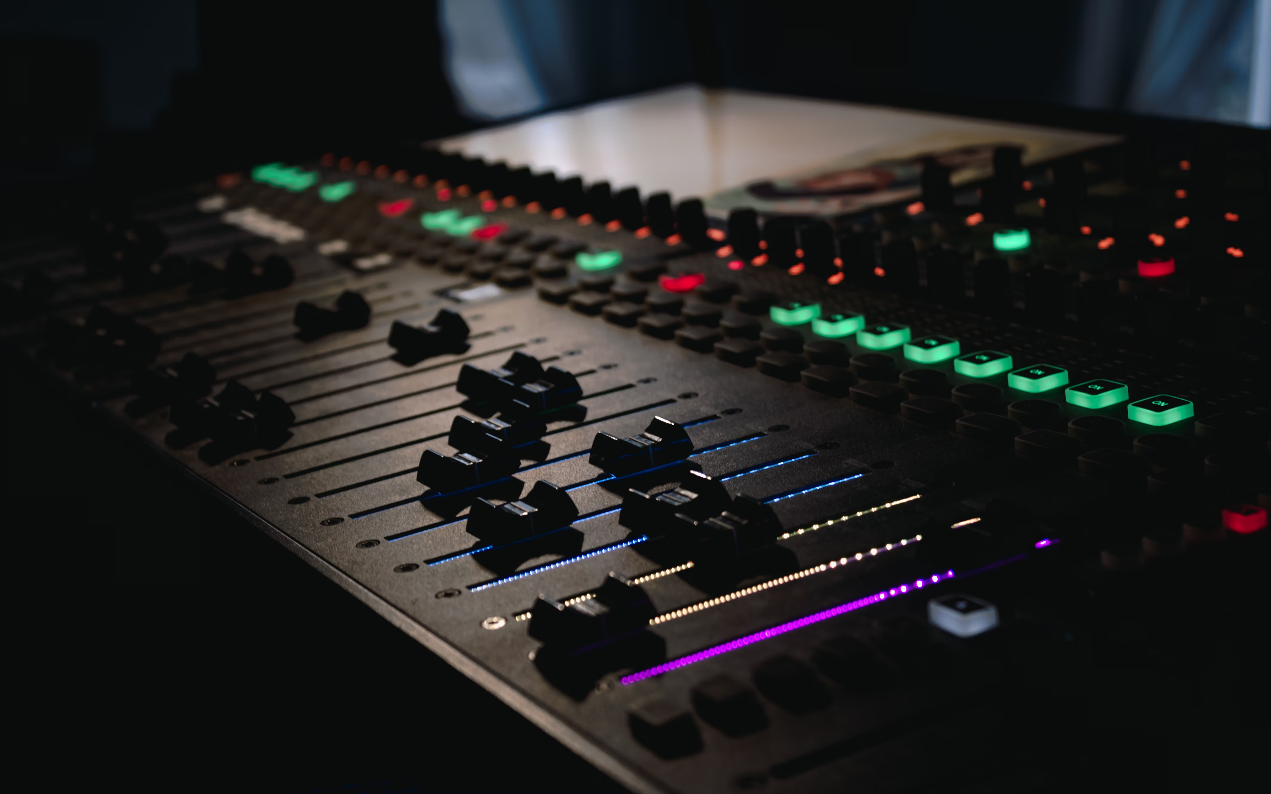 Close up of a sound board, recording royalty free music and sound effects